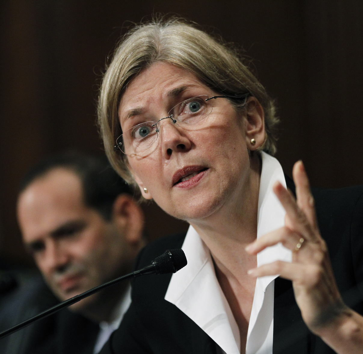 Elizabeth Warren, right, head of the Congressional Oversight Panel, and Neil Barofsky, left, special inspector general for TARP, testify before the Senate Finance Committee hearing to examine the Troubled Asset Relief Program (TARP) on Capitol Hill in Washington, Wednesday, July 21, 2010.  (AP Photo/Manuel Balce Ceneta) (Manuel Balce Ceneta)