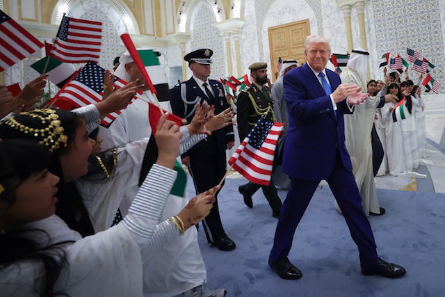 President Donald J. Trump is greeted by young girls as he arrives for an official arrival ceremony at Qasr al Watan (Palace of the Nation) May 15, 2025, in Abu Dhabi, United Arab Emirates. (Win McNamee/Getty Images)